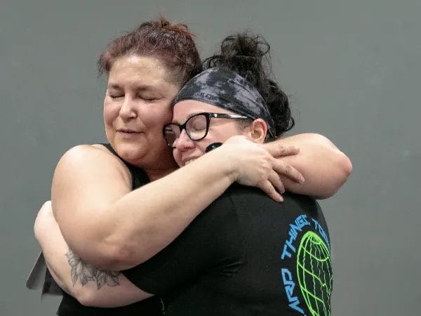 Woman hugging on training at CrossFit Winnebago